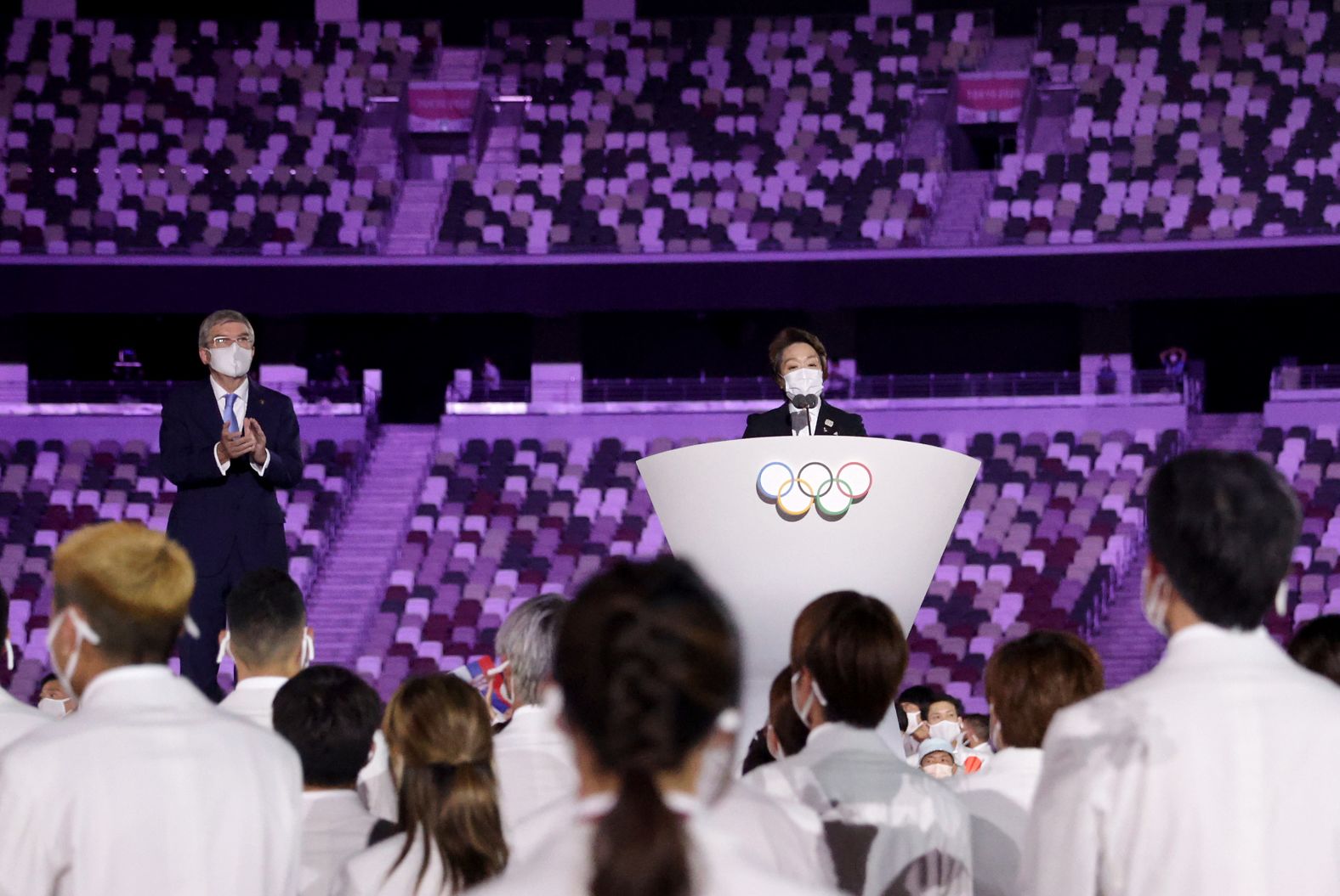 Seiko Hashimoto, president of the Tokyo 2020 organizing committee, makes a speech during the opening ceremony. At left is Thomas Bach, president of the International Olympic Committee.