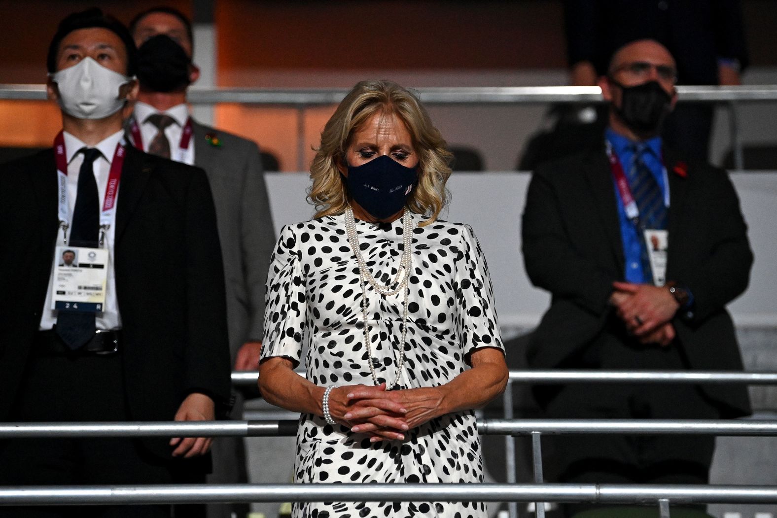 Jill Biden, the first lady of the United States, takes part in a moment of silence during the opening ceremony.