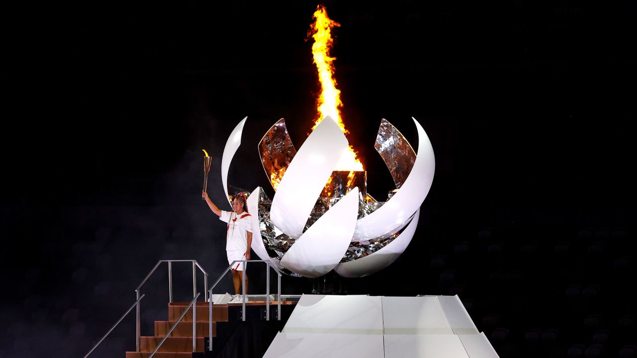 Naomi Osaka of Team Japan lights the Olympic cauldron with the Olympic torch during the opening ceremony of the Tokyo 2020 Olympic Games on Friday, July 23.