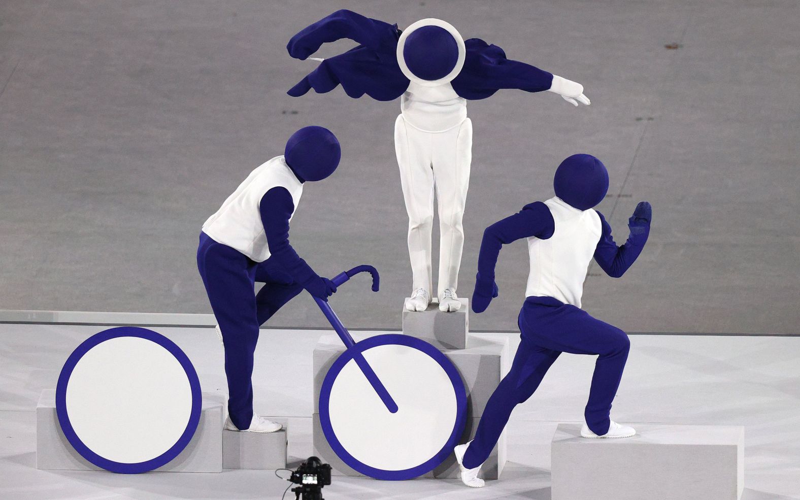Live performers pose as the triathlon pictogram during the opening ceremony. There were 50 sports taking place this year in the Tokyo Olympics, and all of their <a href="index.php?page=&url=https%3A%2F%2Folympics.com%2Fen%2Fnews%2Ftokyo-2020-unveils-games-pictograms" target="_blank" target="_blank">pictograms</a> were acted out by the performers.