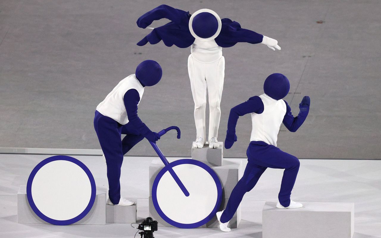 Live performers pose as the triathlon pictogram during the opening ceremony. There were 50 sports taking place this year in the Tokyo Olympics, and all of their <a href="https://olympics.com/en/news/tokyo-2020-unveils-games-pictograms" target="_blank" target="_blank">pictograms</a> were acted out by the performers.
