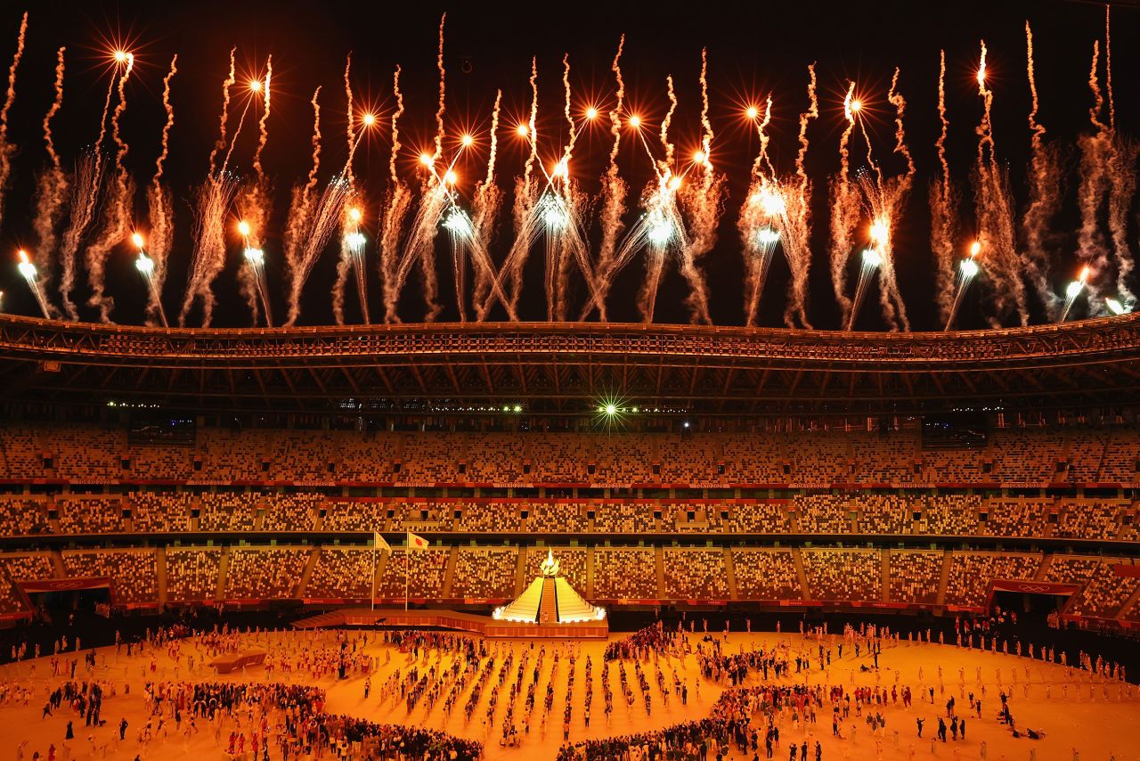 Fireworks go off after Osaka lit the Olympic cauldron.