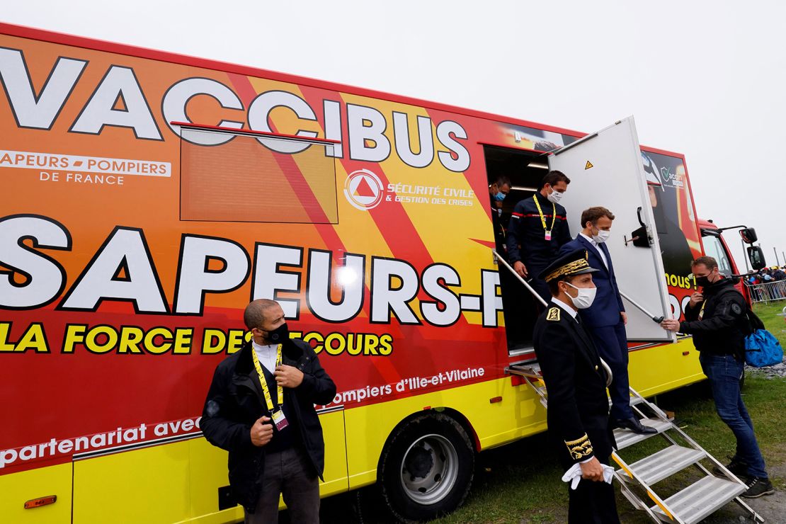 French President Emmanuel Macron visits a traveling vaccination center in July.