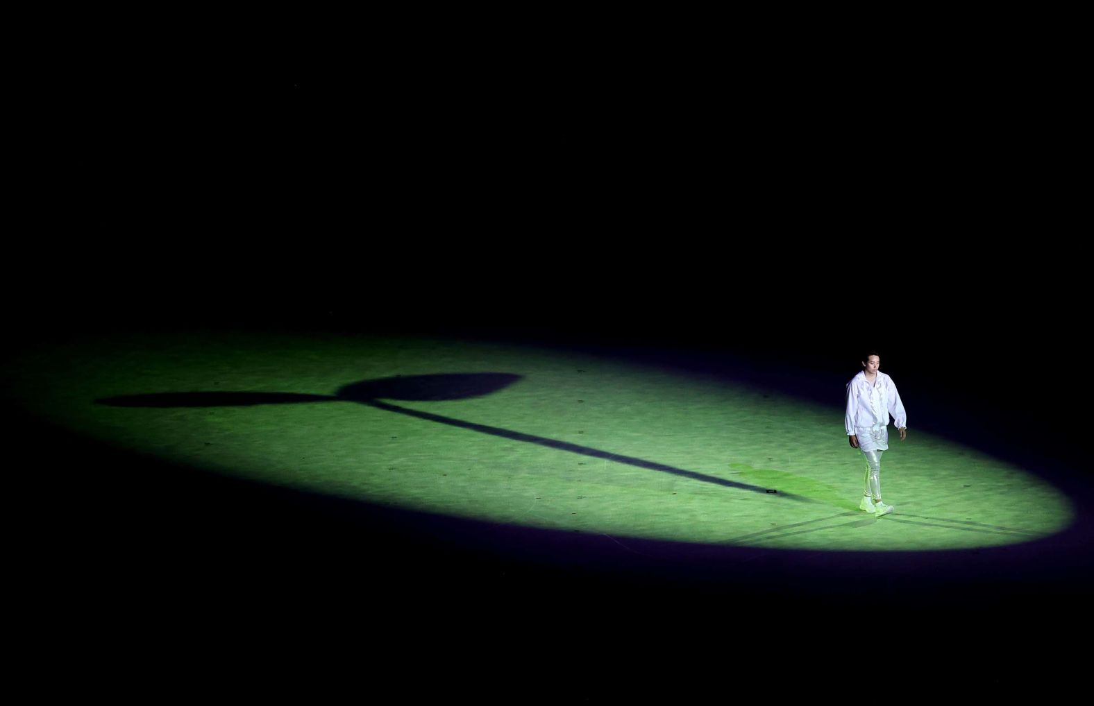 A lone performer is seen during the start of the opening ceremony.