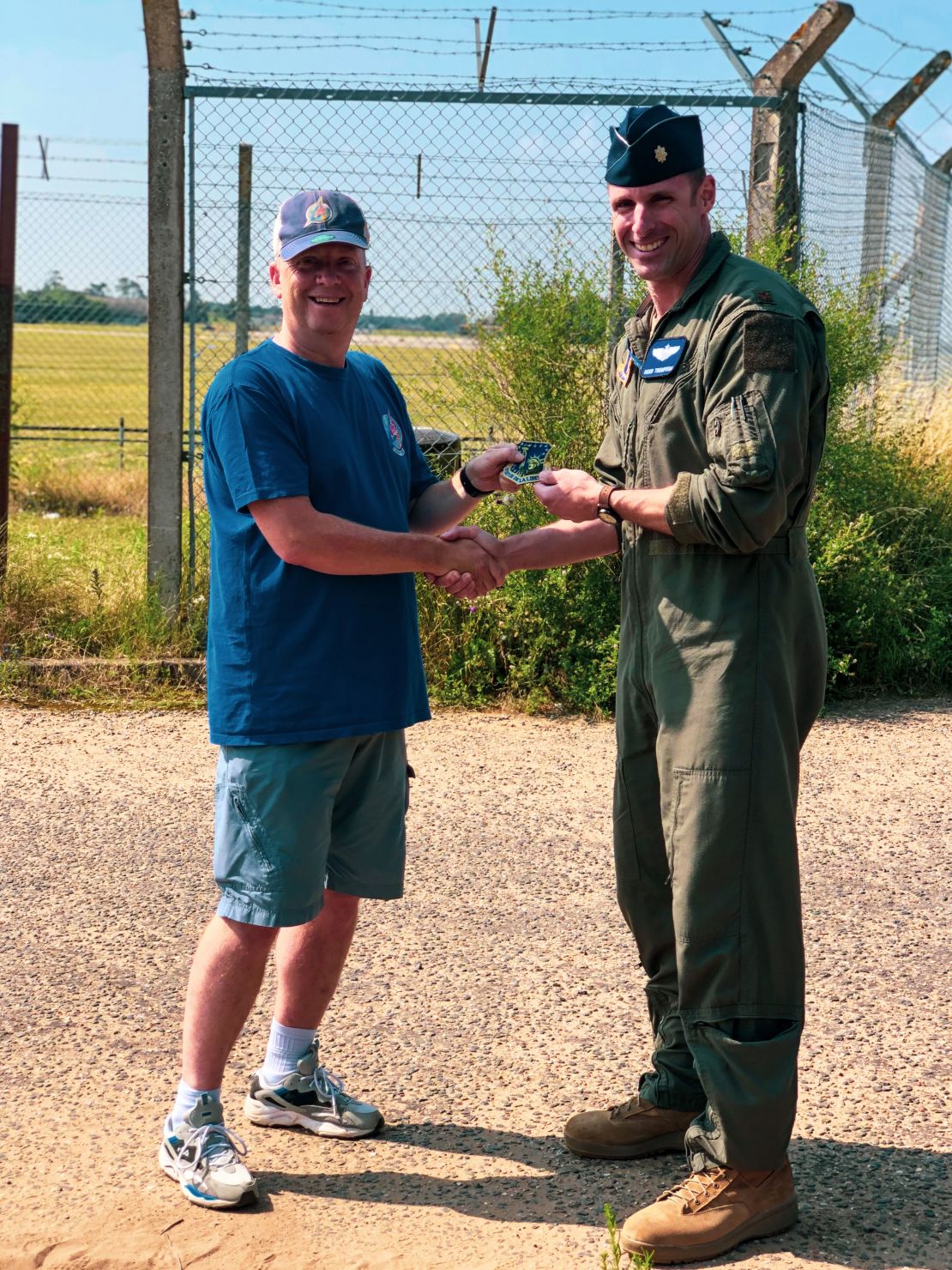 Photographer Ian Simpson meets fighter pilot Maj. Grant Thompson on July 20, 2021 after Simpson made a potentially lifesaving intervention when he spotted something wrong with Thompson's F-15E Strike Eagle fighter jet.