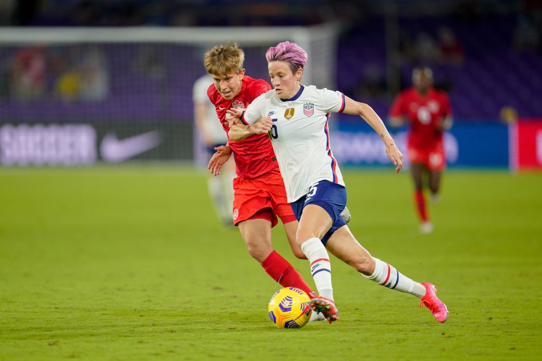 Megan Rapinoe (right) flies past Quinn of Canada during a game between Canada and the US Women's National Team in Florida. 