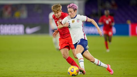Megan Rapinoe (right) flies past Quinn of Canada during a game between Canada and the US Women's National Team in Florida. 