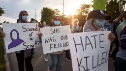 Young women walk with signs during a Multi-Faith March to End Hatred after four members of a Muslim family were killed on Sunday in what police called a hate crime, Friday, Jun 11, 2021 in London Ontario. (Geoff Robins/The Canadian Press via AP)