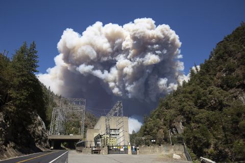Plumes of smoke from the Dixie Fire rise above California's Plumas National Forest, near the Pacific Gas and Electric Rock Creek Power House, on July 21.