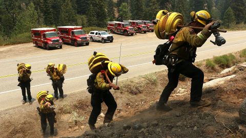 A Cal Fire crew works to keep the Tamarack Fire from crossing Highway 88 just west of Woodfords in Alpine County, California, on July 23, 2021.