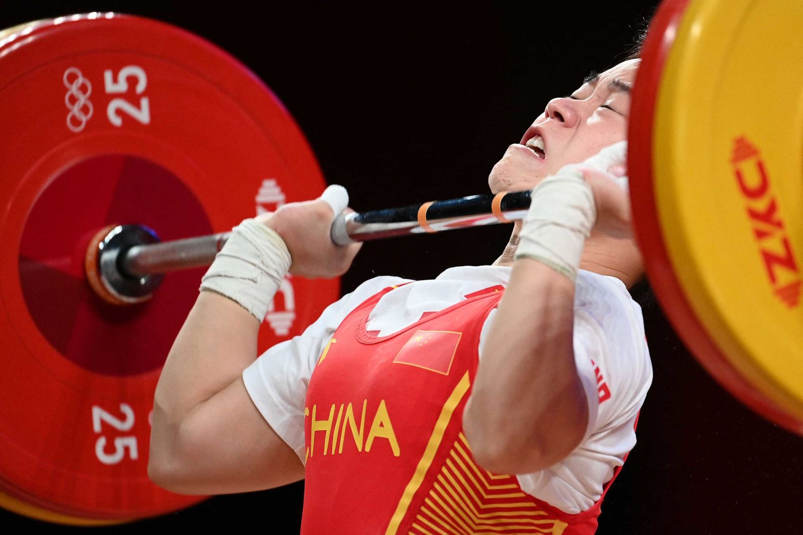 Chinese weightlifter Hou Zhihui competes on July 24. She <a href="index.php?page=&url=https%3A%2F%2Fedition.cnn.com%2Fworld%2Flive-news%2Ftokyo-2020-olympics-07-24-21-spt%2Fh_7eef141d1b789bd62d1b4ad4e61a7fd5" target="_blank">set an Olympic record</a> in her 49-kilogram weight class, lifting 94 kilograms in the snatch round and 116 kilograms in the clean-and-jerk.