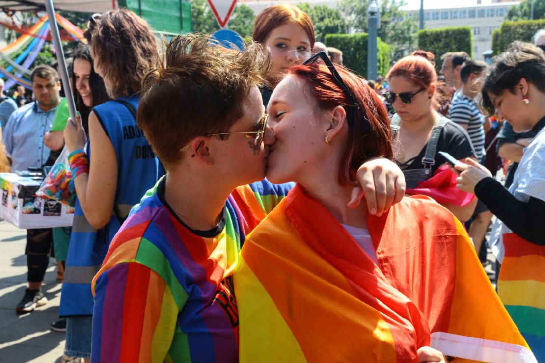 LGBTQ activists kiss at a Pride event in Budapest on July 24.