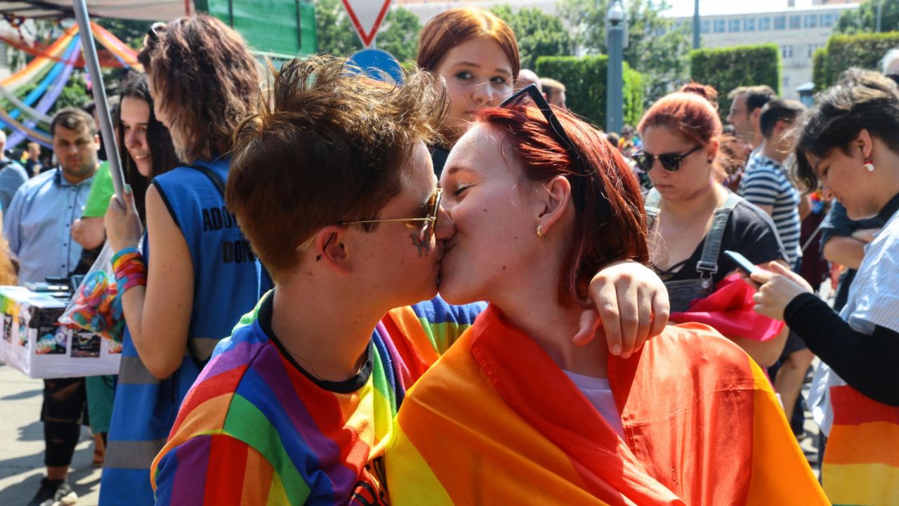 LGBTQ activists kiss at a Pride event in Budapest on July 24.