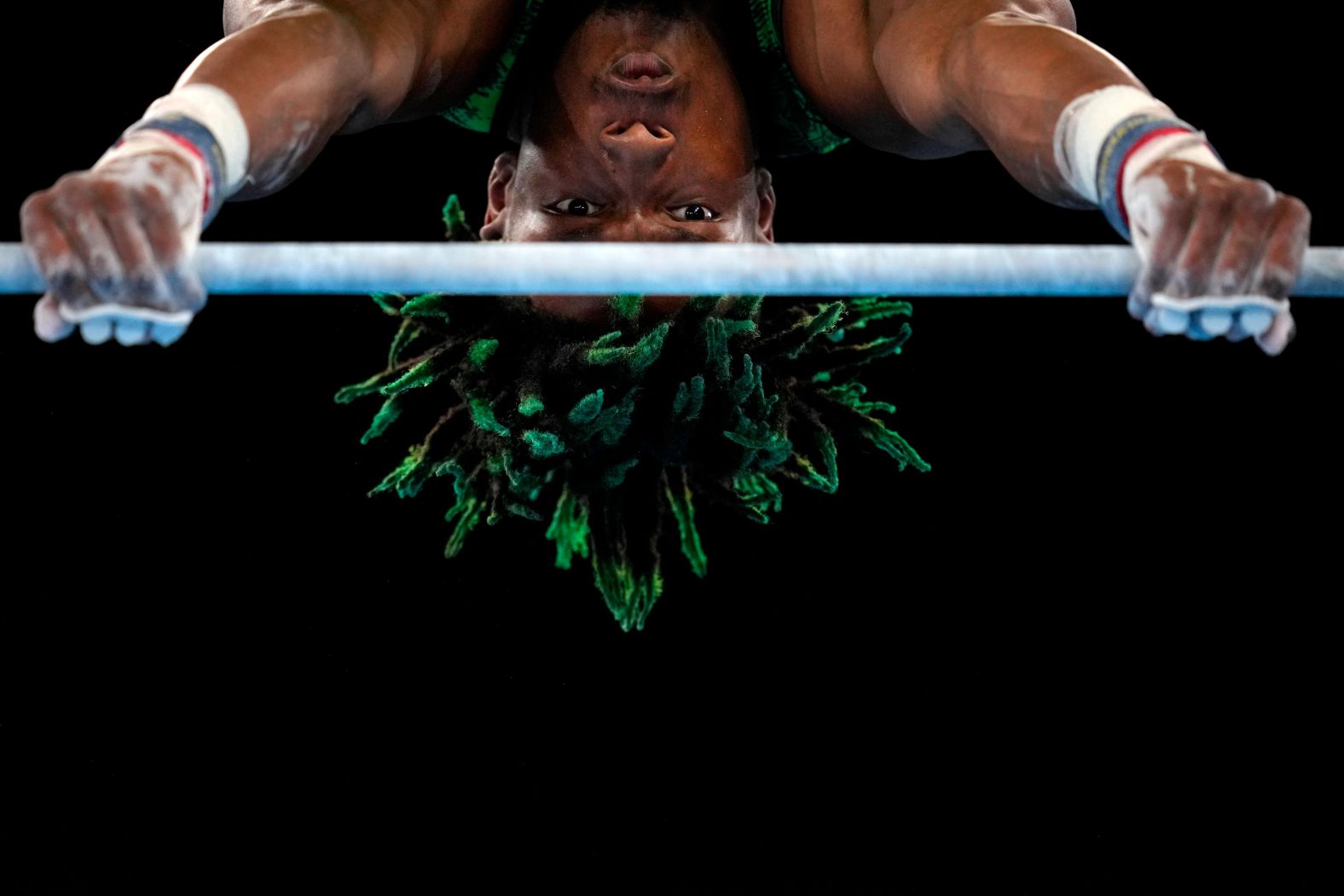 Nigerian gymnast Uche Eke competes on the horizontal bar on July 24.