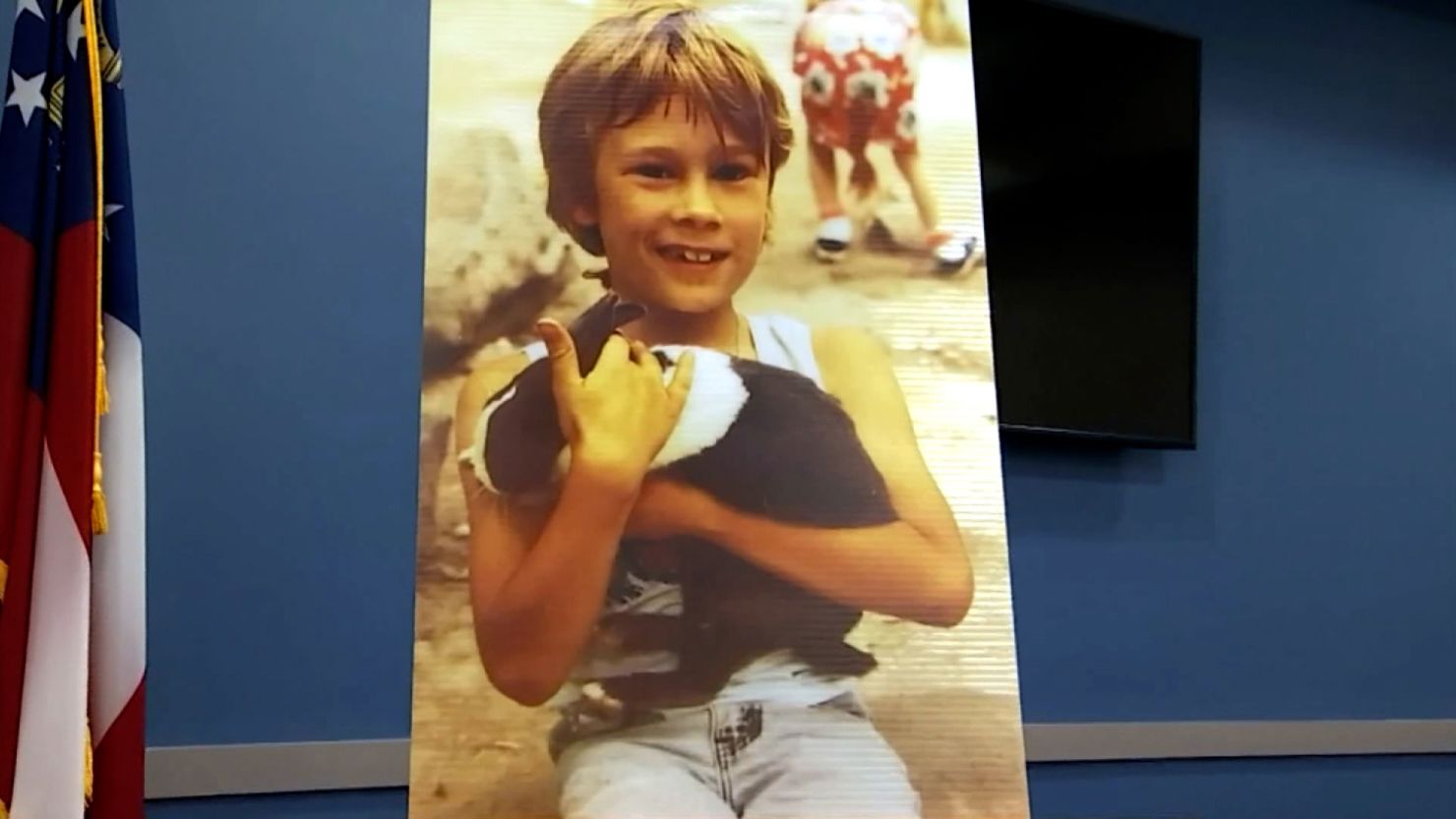 A picture of Joshua Harmon was displayed at a news conference by Roswell Police on Friday, July 23, 2021, when they announced a 56-year-old man had been arrested in connection to his murder 33 years ago 