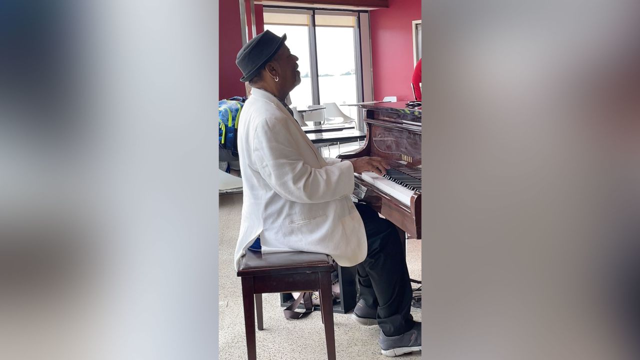 Carter plays piano at a pizzeria and bar on Concourse A at Hartsfield-Jackson Atlanta International Airport.