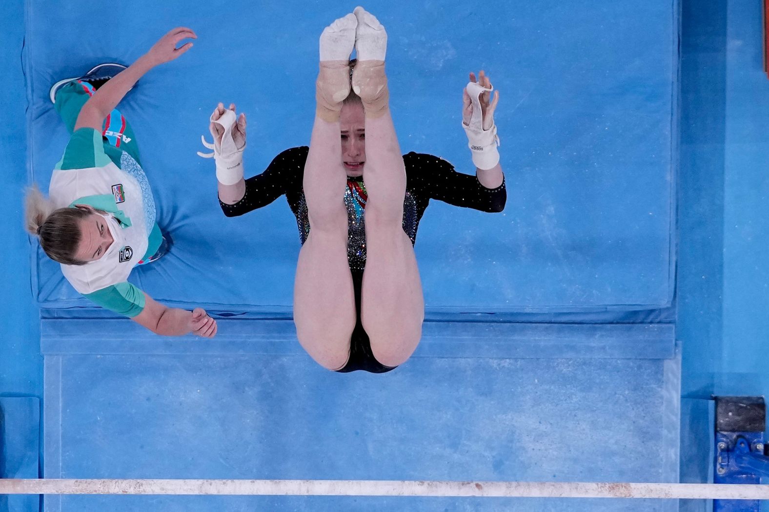 Marina Nekrasova, a gymnast from Azerbaijan, competes on the uneven bars during the qualification round on July 25.