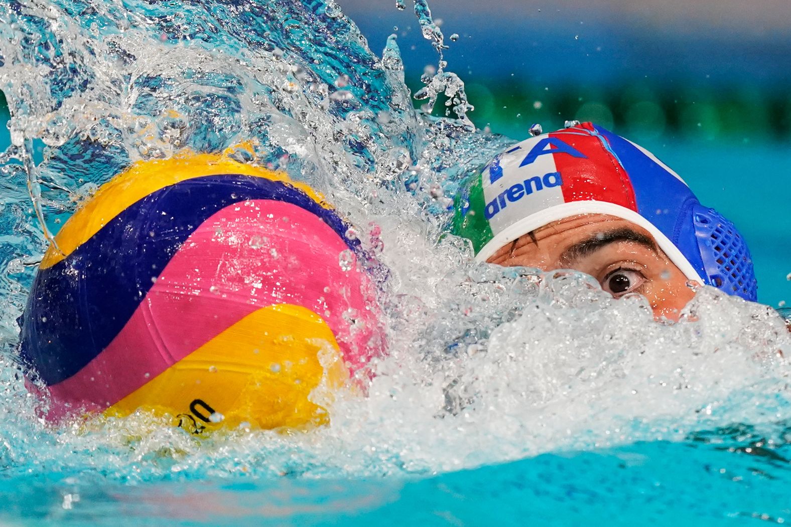 Italy's Alessandro Velotto moves the ball during a water polo match against South Africa on July 25.