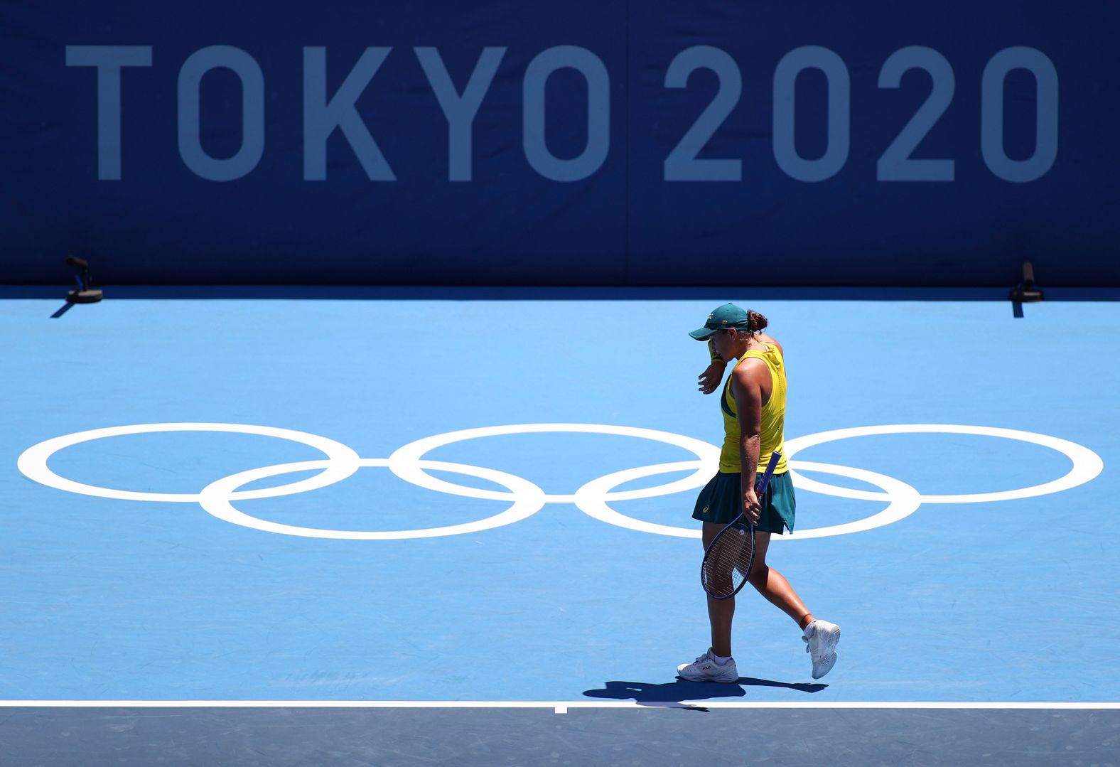 Australian tennis star Ashleigh Barty, the world's top-ranked player who won Wimbledon earlier this month, reacts during her <a href="index.php?page=&url=https%3A%2F%2Fwww.cnn.com%2Fworld%2Flive-news%2Ftokyo-2020-olympics-07-25-21-spt%2Fh_875b23b20b49f797a713d5a76988e298" target="_blank">first-round loss </a>to Spain's Sara Sorribes Tormo on July 25. Sorribes Tormo won 6-4, 6-3.