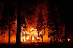 A home burns as the Dixie fire tears through the Indian Falls neighborhood of unincorporated Plumas County, California, on Saturday, July 24, 2021.