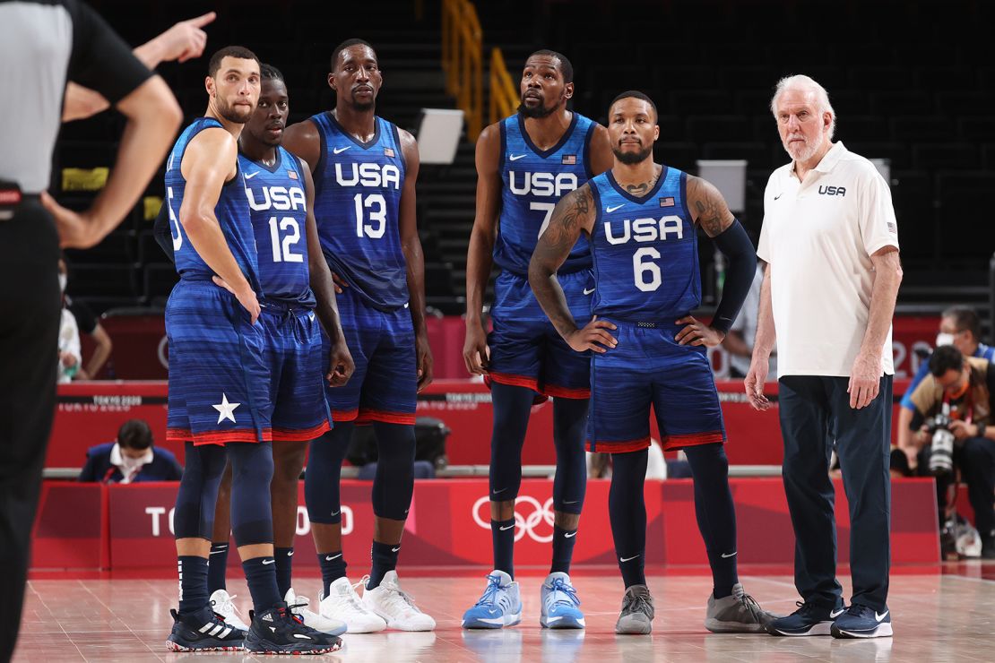 From left, Zachary Lavine, Jrue Holiday, Bam Adebayo, Kevin Durant, Damian Lillard, and head coach Gregg Popovich of Team USA look on in disbelief during their game against France on Sunday, July 25.