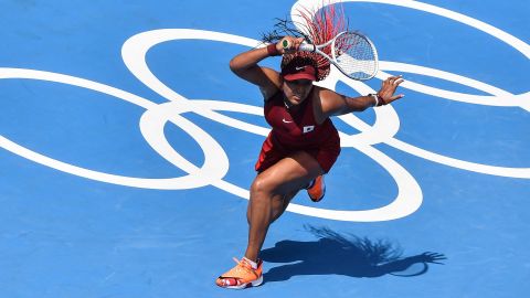 Osaka hits a forehand as she makes a winning start to the Tokyo Olympics. 
