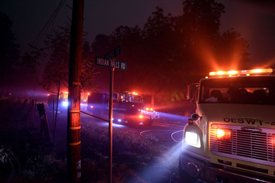 Firefighters try to reach a fire site in Quincy, California, on July 25.