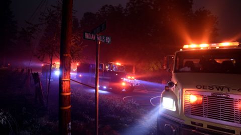 Firefighters try to reach a fire site in Quincy, California, on July 25.