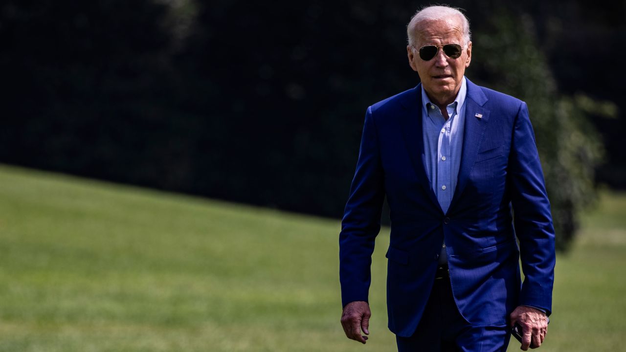 President Joe Biden walks across the South Lawn to the White House earlier this month. 