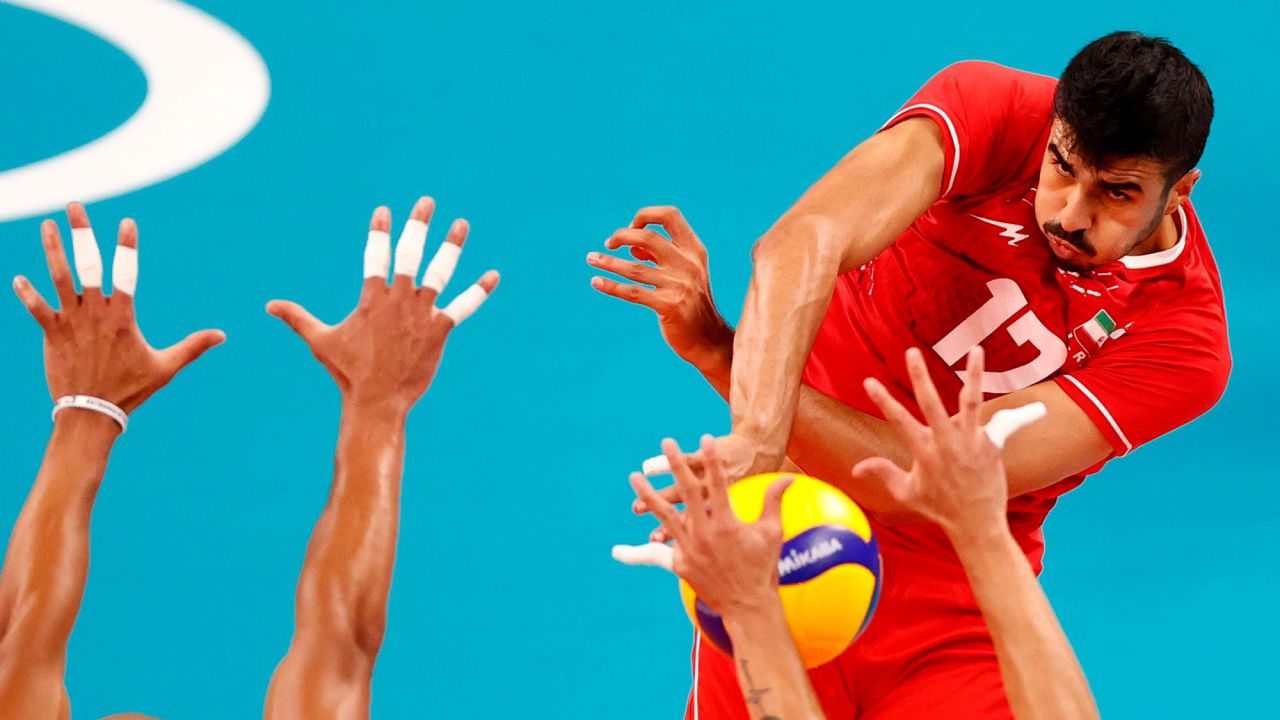 Iran's Meisam Salehi spikes the ball during a volleyball match against Venezuela on July 26.