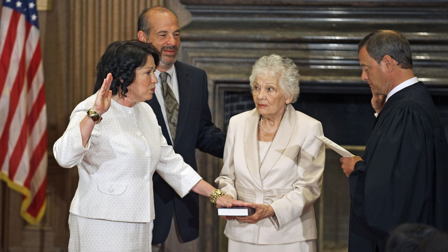 Judge Sonia Sotomayor is sworn in to the Supreme Court on August 8, 2009, by Chief Justice John Roberts as her mother Celina holds the Bible and her brother Juan Luis looks on.