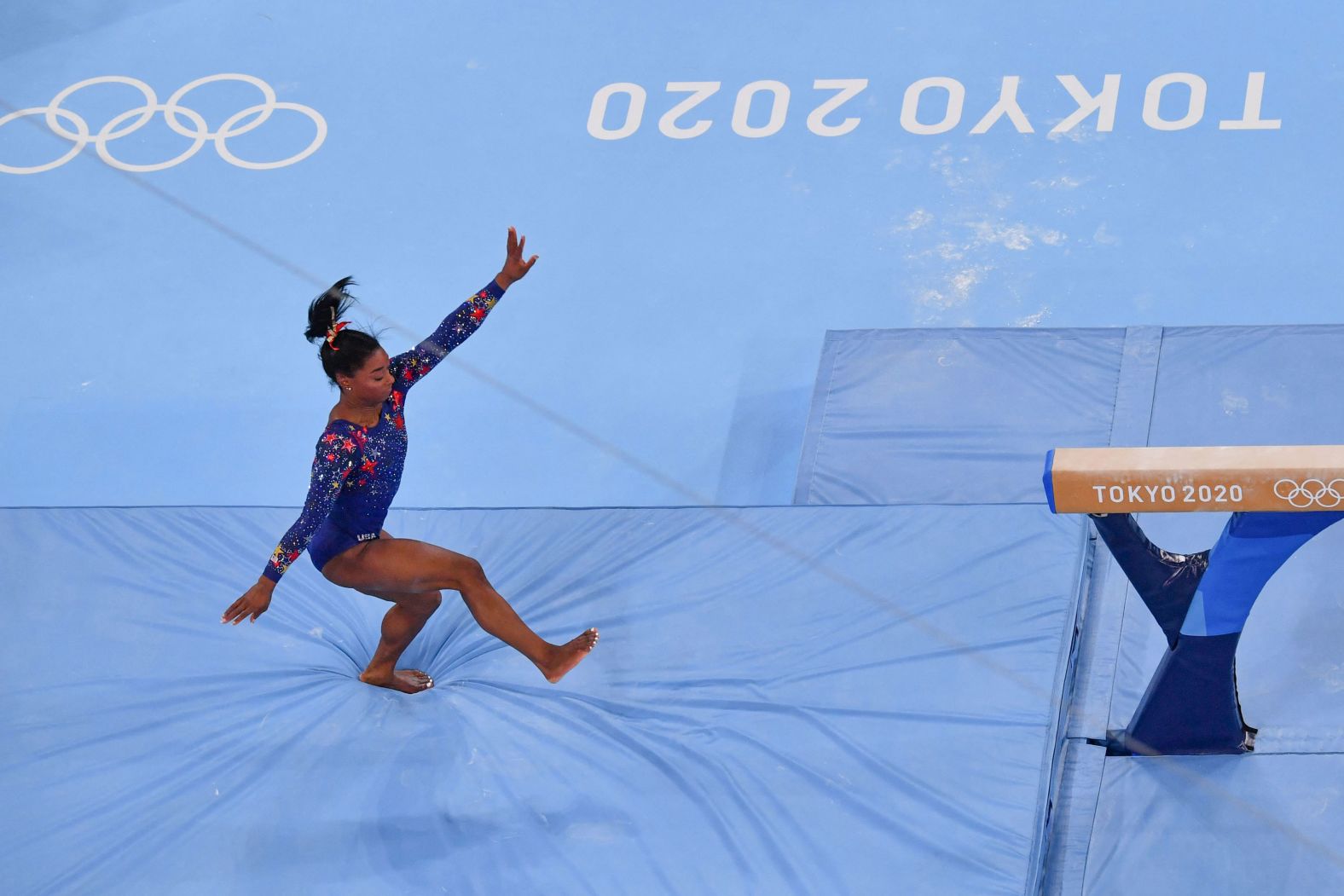 US gymnast Simone Biles stumbles on a balance beam dismount during the qualification event on July 25. She still qualified for the event finals, and the United States <a href="index.php?page=&url=https%3A%2F%2Fedition.cnn.com%2Fworld%2Flive-news%2Ftokyo-2020-olympics-07-25-21-spt%2Fh_fa065b586bab1321ad9e8ea5da343c94" target="_blank">finished second in qualification for the all-around.</a> "Obviously, there are little things we need to work on, so we'll go back and practice and work on that just so we can do our best performance at team finals (on Tuesday), because that's what matters," Biles said.