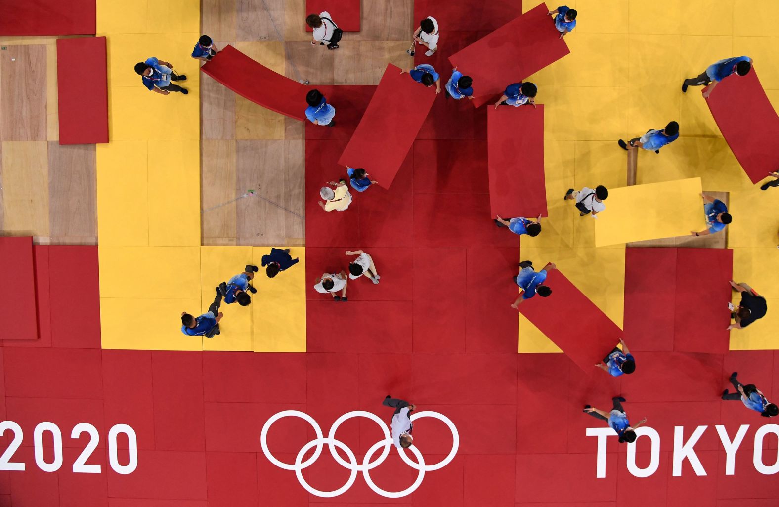 Staff members prepare for judo competition at the Budokan arena in Tokyo.