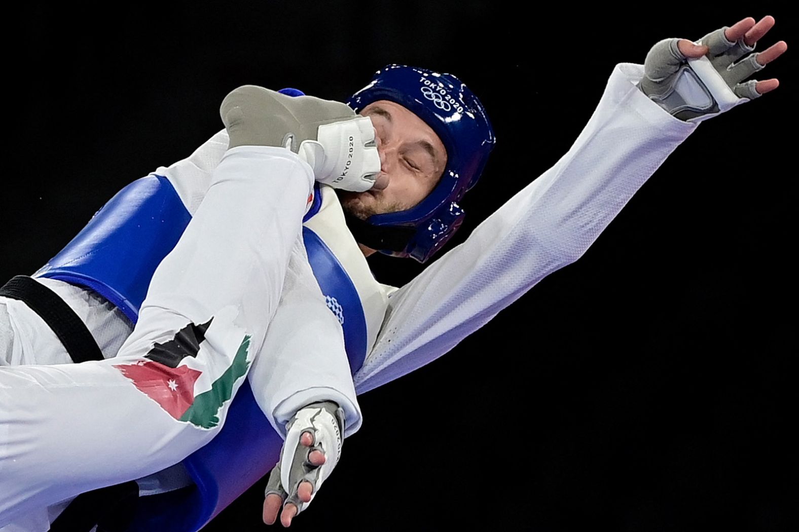 Norway's Richard Andre Ordemann is kicked in the face by Jordan's Saleh Elsharabaty during a taekwondo bout on July 26. Elsharabaty won 5-4.