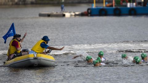 Men's triathlon false start as media boat blocks competitors ...
