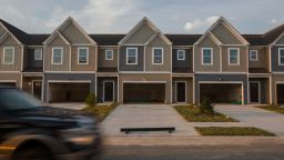 "Sold" signs in the windows of new townhomes in the Hunter's Crossing subdivision in Sumter, South Carolina, U.S., on Tuesday, July 6, 2021. 