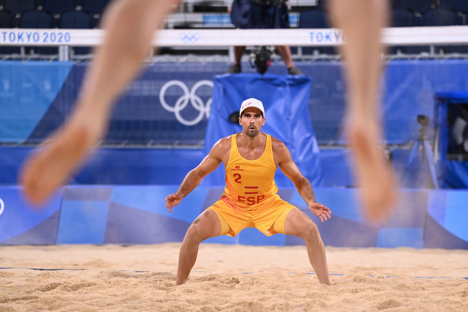 Spain's Adrian Gavira Collado waits for a serve during a beach volleyball match on July 26.
