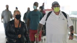 Charlotte Charles, left, and Tim Dunn, the parents of Harry Dunn arrive at Heathrow Airport in London, before departing on a flight to the US to give evidence under oath as part of a damages claim against their son's alleged killer, Tuesday June 29, 2021.  Harry Dunn was killed aged 19 in August 2019 in a collision between his motorbike and a car being driven on the wrong side of the road by American Anne Sacoolas. (Andrew Matthews/PA via AP)