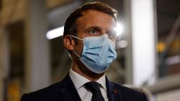 France's President Emmanuel Macron speaks with doctors and nurses working at the French Polynesia Hospital Centre in Papeete following his arrival for a visit to Tahiti in French Polynesia on July 24, 2021.