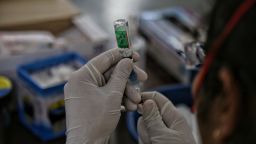 A health worker prepares a dose from a vial of Covishield vaccine at a Covid-19 vaccination centre, on July 22, 2021 in New Delhi, India. 