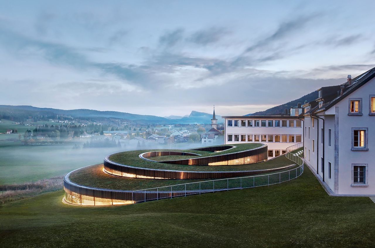 Designed by BIG, Musée Atelier Audemars Piguet is a watchmaking museum in the remote Swiss mountain town of Le Brassus.