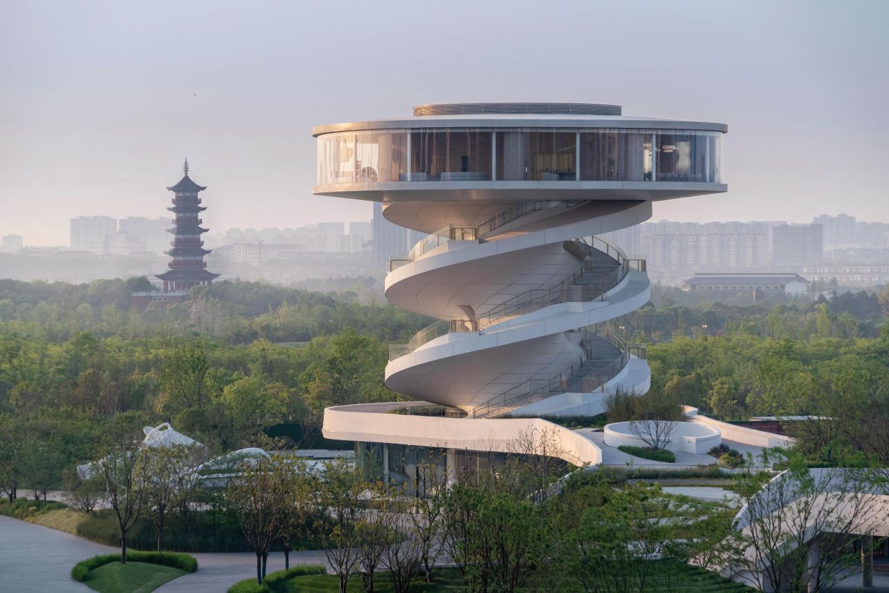 Serving as a community center and observation deck, Nordic Office of Architecture's Nanchang Waves, in the Chinese city of Nanchang, features a double helix-inspired design.