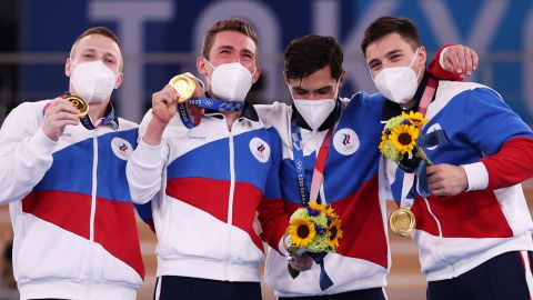 Gymnasts from Team ROC pose with the gold medal after winning the Men's Team Final on day three of the Tokyo Olympic Games.