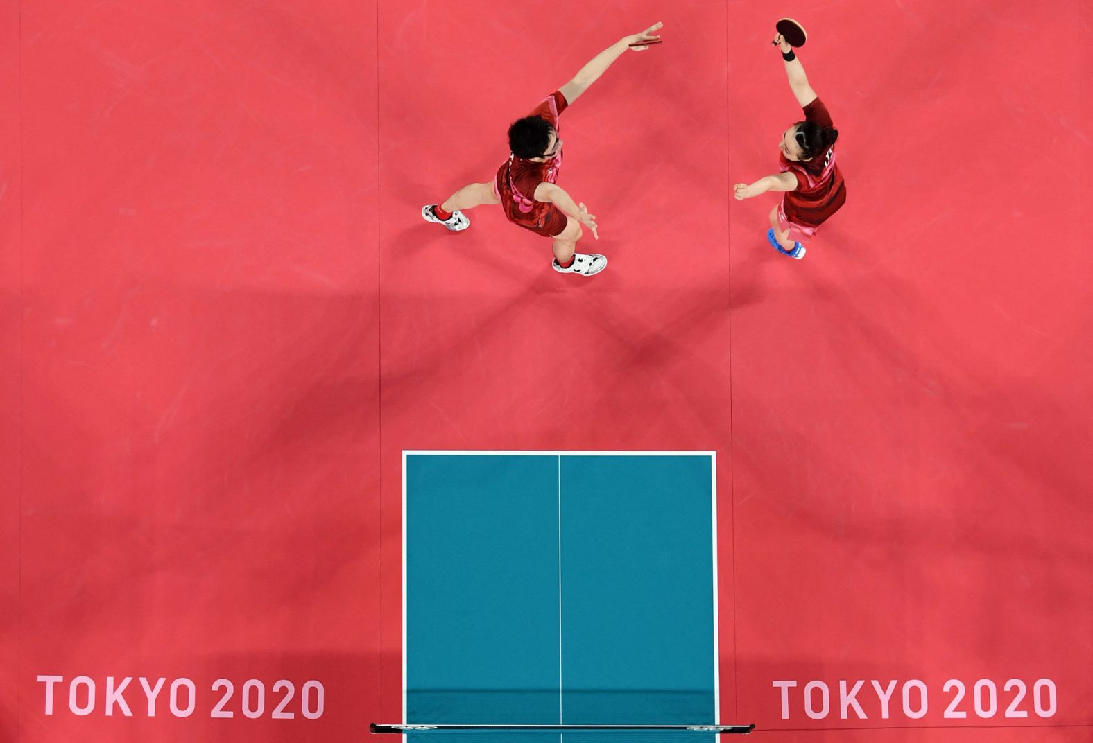 Japanese table-tennis players Jun Mizutani, left, and Mima Ito celebrate <a href="index.php?page=&url=https%3A%2F%2Fwww.cnn.com%2Fworld%2Flive-news%2Ftokyo-2020-olympics-07-26-21-spt%2Fh_321ddbea93f900e73308f3c94c4b6015" target="_blank">their dramatic victory</a> over China in the mixed-doubles final on July 26. Mizutani and Ito came back from two sets down to win 4-3, clinching the final set 11-6. The win ended years of Chinese dominance in the sport. China had won every Olympic title in table tennis since South Korea's Ryu Seung-min triumphed in the men's singles competition at the 2004 Athens Games.