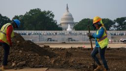 FILE - In this July 21, 2021, file photo workers repair a park near the Capitol in Washington. Senators working on the infrastructure plan hope to have a bill ready to be voted on next week. President Joe Biden has made passing the bipartisan plan a top priority, the first of his two-part $4 trillion proposal to rebuild, but a Senate test vote failed this week after Republicans said they needed more time to finish the package and review the details. (AP Photo/J. Scott Applewhite, File)