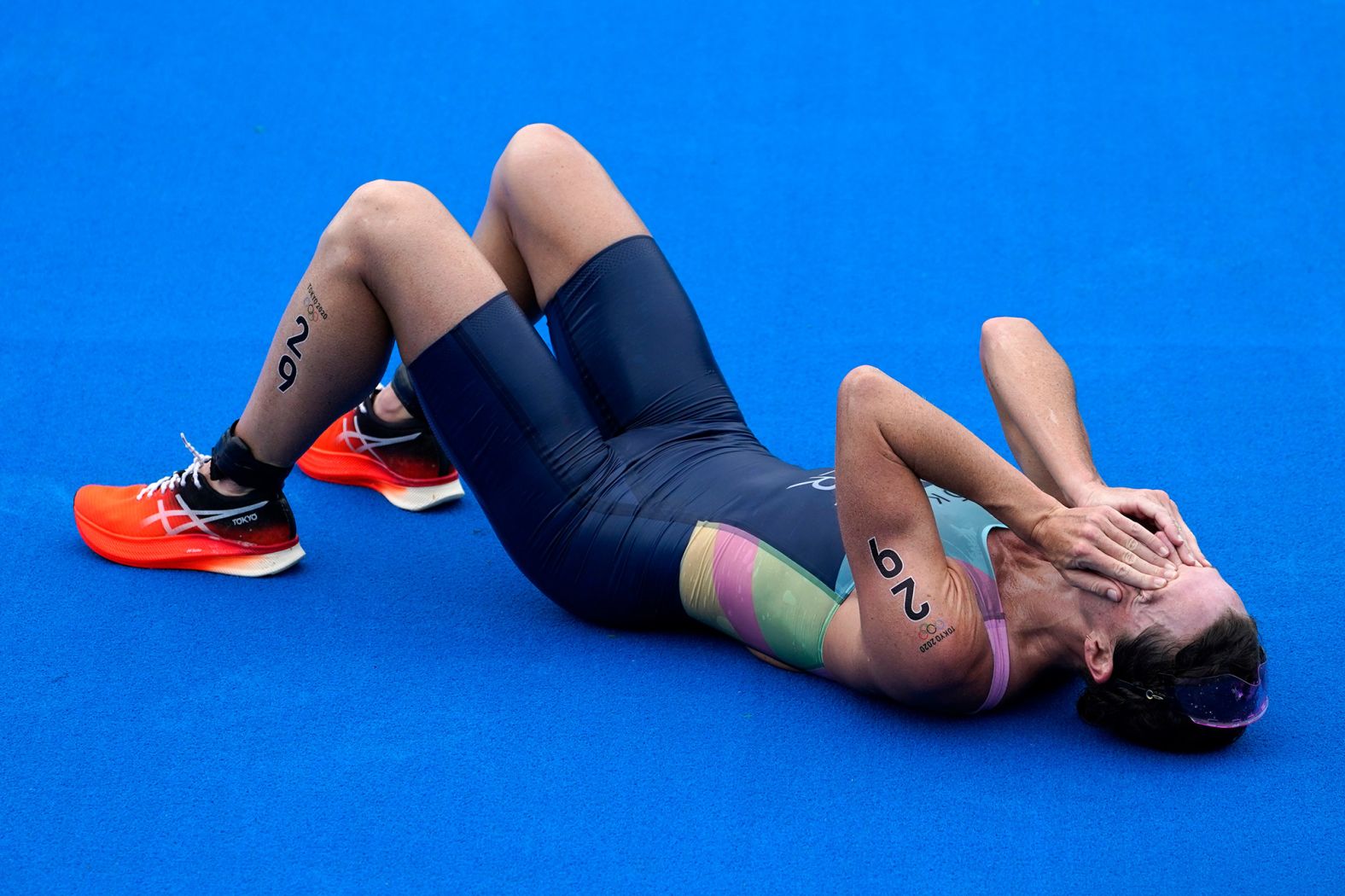 Bermuda's Flora Duffy celebrates after she won <a href="index.php?page=&url=https%3A%2F%2Fwww.cnn.com%2Fworld%2Flive-news%2Ftokyo-2020-olympics-07-26-21-spt%2Fh_0ec1b5b43d5f069ead593b41c5652ef1" target="_blank">gold in the triathlon</a> on July 27. It's the first-ever Olympic gold medal for an athlete representing Bermuda.