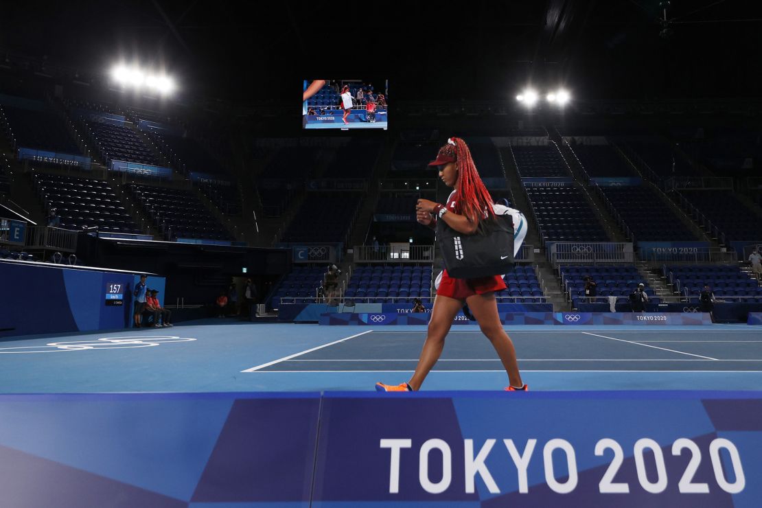 Naomi Osaka of Team Japan leaves the court after losing her Women's Singles Third Round match against Marketa Vondrousova of Team Czech Republic at the Tokyo 2020 Olympic Games.