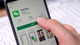 Close-up to install WeChat app on a smartphone