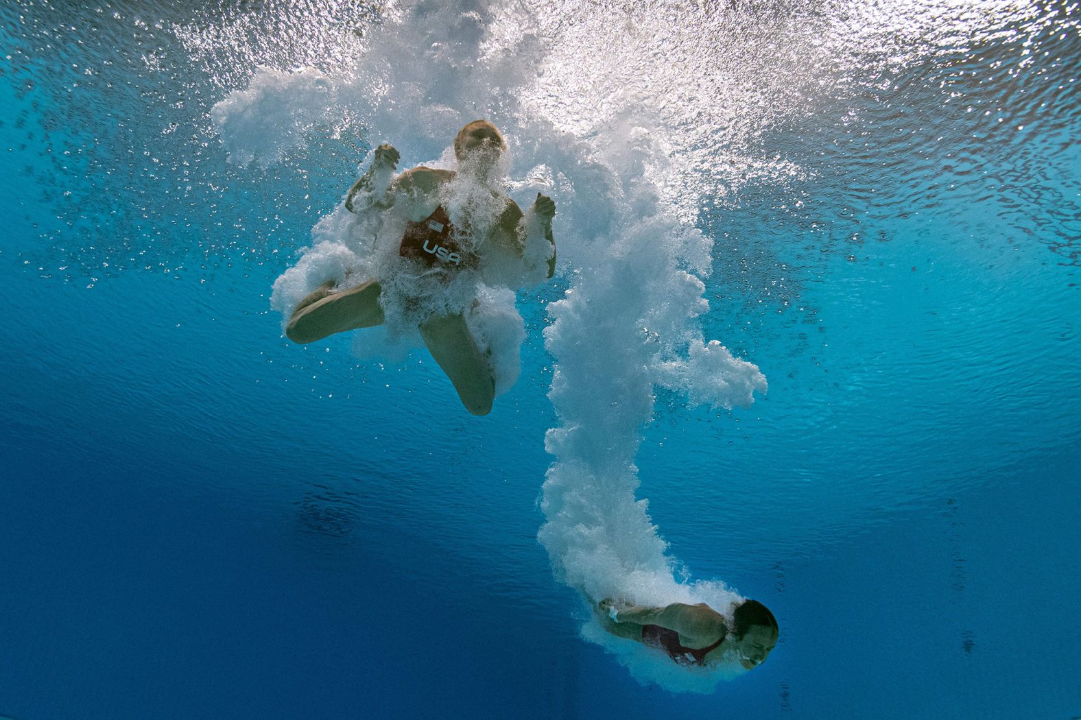 An underwater view shows the United States' Delaney Schnell, left, and Jessica Parratto after a dive in the the synchronized 10-meter platform event on July 27.