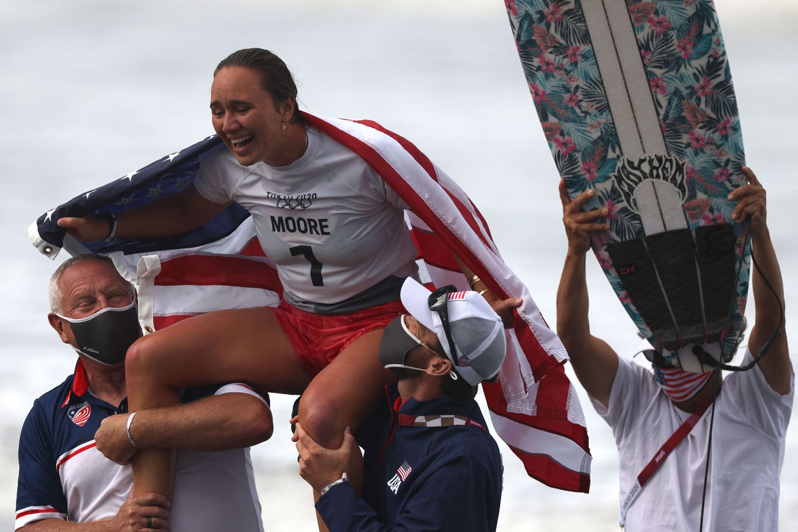 The United States' Carissa Moore celebrates after <a href="index.php?page=&url=https%3A%2F%2Fwww.cnn.com%2Fworld%2Flive-news%2Ftokyo-2020-olympics-07-27-21-spt%2Fh_fef4a80c23cb5ec5e96752ab3be966f2" target="_blank">she won the first-ever Olympic gold medal in surfing</a> on July 27.